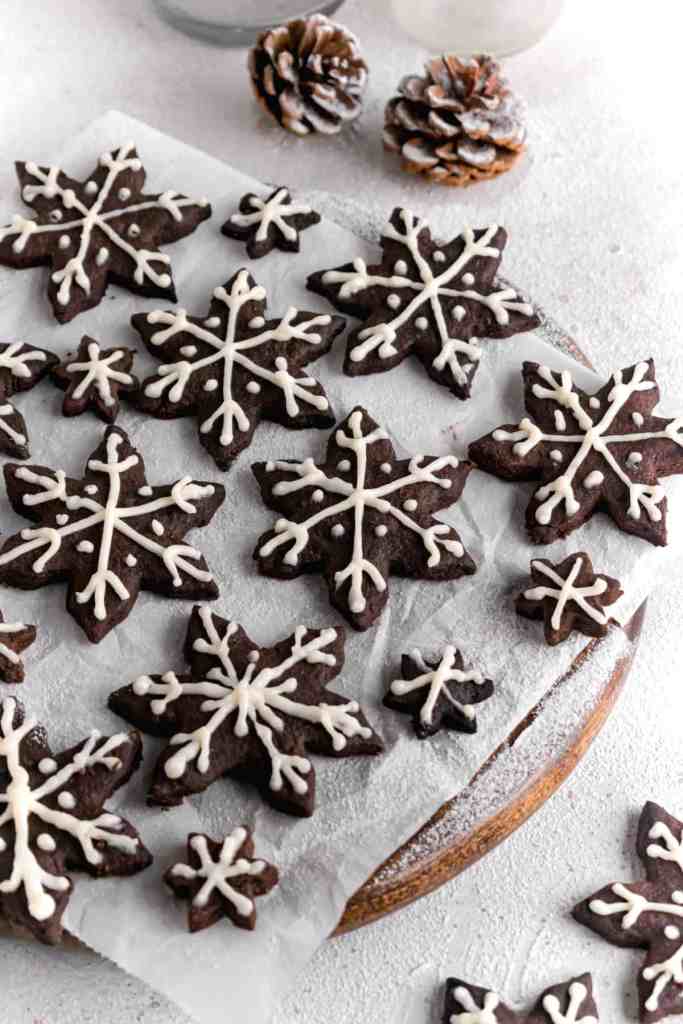 Snowy Snowfall scene - Baked Chocolate Snowflake Cookies Christmas baking with snow covered trees and pinecones