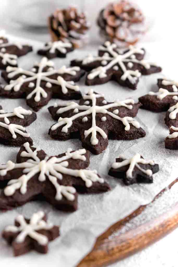 Snowy Snowfall scene - Baked Chocolate Snowflake Cookies Christmas baking with snow covered trees and pinecones