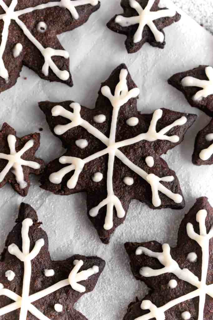 Snowy Snowfall scene - Baked Chocolate Snowflake Cookies Christmas baking with snow covered trees and pinecones