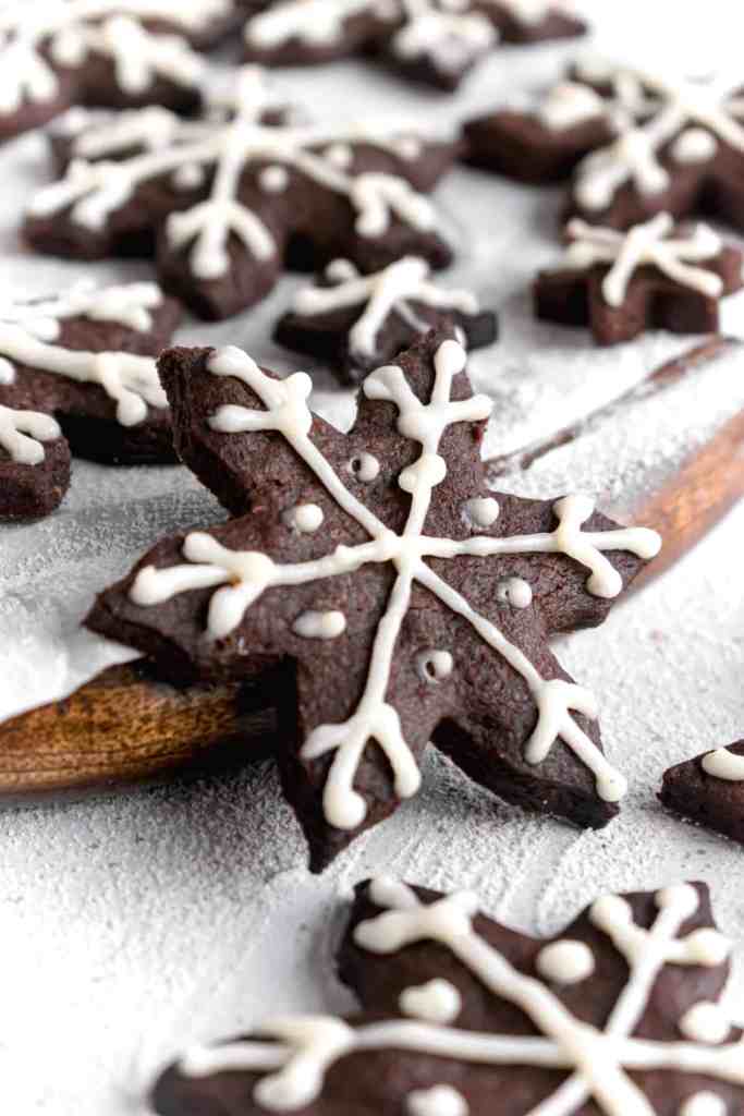 Snowy Snowfall scene - Baked Chocolate Snowflake Cookies Christmas baking with snow covered trees and pinecones