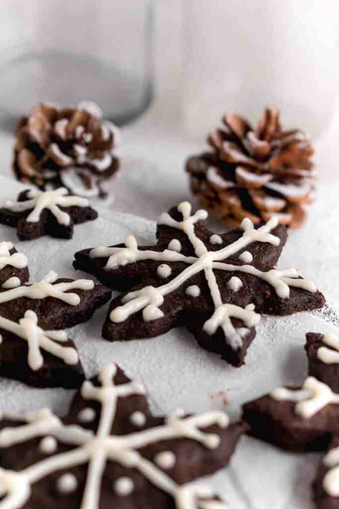 Snowy Snowfall scene - Baked Chocolate Snowflake Cookies Christmas baking with snow covered trees and pinecones