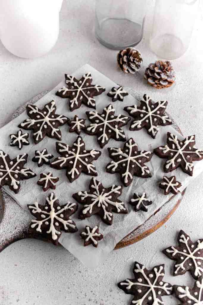 Snowy Snowfall scene - Baked Chocolate Snowflake Cookies Christmas baking with snow covered trees and pinecones