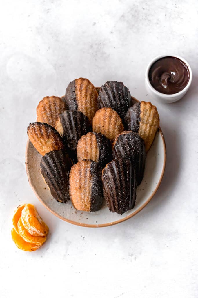 Sea shell shaped sponge cakes aka madeleines on a plate