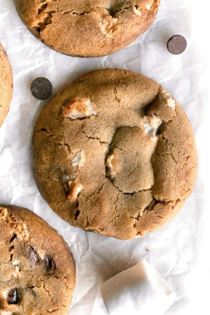 Large chocolate chip marshmallow cookie on a parchment paper